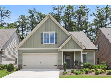 Charming craftsman-style home with a welcoming front porch and attached two-car garage at 3112 Patriot Sw Sq, Marietta, GA 30064