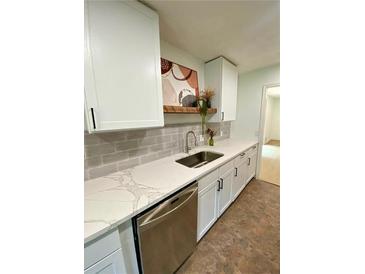 Beautiful kitchen with white cabinetry, stainless steel appliances, and stylish countertops at 364 Stafford Sw St, Marietta, GA 30064