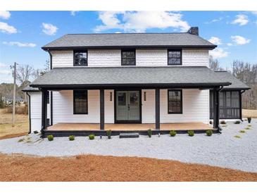Charming two-story home with a welcoming front porch and a fresh, modern exterior at 260 Sandy Lake Cir, Fayetteville, GA 30214