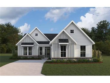 Charming single-Gathering home featuring board and batten siding, stone accents, and a well-manicured lawn at 15 Dartmoor Cir, Dallas, GA 30157