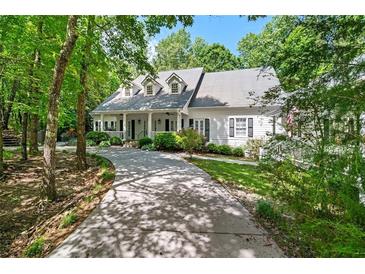Beautiful home with a large front yard and inviting front porch at 2058 Sewanee Ct, Villa Rica, GA 30180