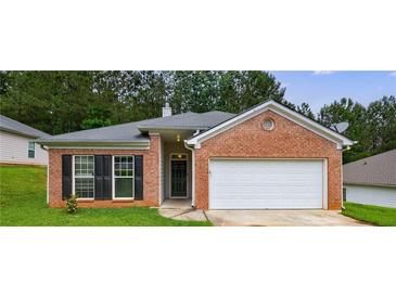 Charming one-story brick home with a well-manicured lawn and an attached two-car garage at 10247 Deep Creek Pl, Union City, GA 30291