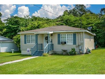 Charming single-story home with a well-maintained lawn and blue shutters at 511 Reid St, Villa Rica, GA 30180