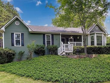 Charming single-Gathering home featuring a cozy porch and a well-maintained lawn at 4812 Shallow Creek Nw Dr, Kennesaw, GA 30144