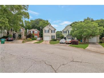 Charming suburban homes with well-maintained lawns and tree-lined street showcasing a peaceful residential neighborhood at 3984 Oak Glenn Dr, Duluth, GA 30096