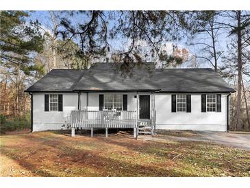 Charming ranch home featuring a covered porch and neatly maintained landscaping at 247 Mandy Ct, Mcdonough, GA 30252
