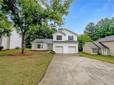 Charming two-story home with a two-car garage and a well-maintained front yard at 2397 Charleston Ter, Decatur, GA 30034