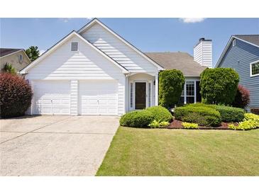 Charming one-story home with a well-manicured lawn and a two-car garage at 4527 Baker Grove Nw Rd, Acworth, GA 30101