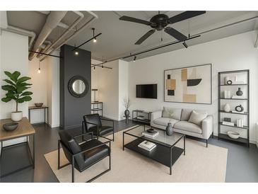 Bright living room featuring modern decor, neutral tones, track lighting, and a stylish ceiling fan at 120 Ralph Mcgill Ne Blvd # 1502, Atlanta, GA 30308