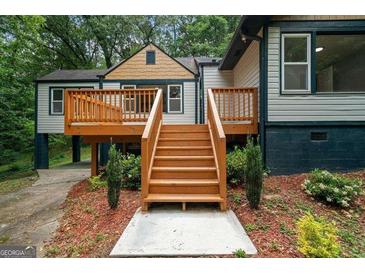 Lovely back deck with natural wood steps perfect for enjoying a relaxing afternoon outdoors at 243 Howell Ter, Atlanta, GA 30331