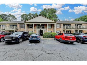 Beautiful brick apartment building with classic columns and convenient parking at 3650 Ashford Dunwoody Rd, Ne, #923 # 923, Atlanta, GA 30319