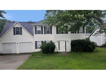 Two-story home with vinyl siding, two-car garage and classic shutters at 3679 Seabass Rd, Decatur, GA 30034