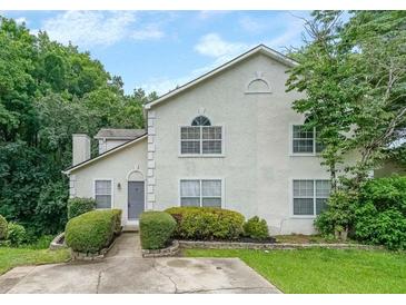 Charming stucco two-story home with well-manicured landscaping and inviting entrance at 4228 Lakes End Nw Dr, Kennesaw, GA 30144