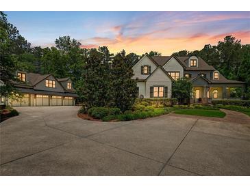 Stunning exterior showcasing well-manicured lawn and driveway leading up to a beautiful two-story home with a three-car garage at 193 Stonegate Trl, Carrollton, GA 30116