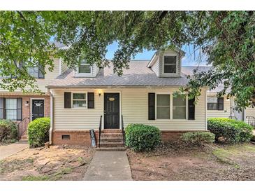 Charming townhome features a welcoming entrance and well-maintained landscaping at 5509 Park S Pl, Atlanta, GA 30349