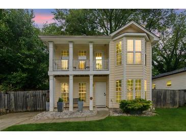 Charming two-story home featuring a welcoming front porch and balcony at 1001 Dunning Se St, Atlanta, GA 30315