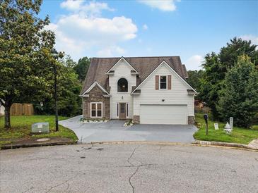 Charming two-story home with stone accents, attached two-car garage and well-maintained landscaping at 3042 Oak Vista Way, Lawrenceville, GA 30044
