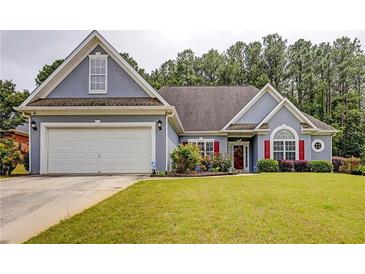 Charming single-Gathering home features a two-car garage, well-manicured lawn, and inviting curb appeal at 231 Yardsley Dr, Mcdonough, GA 30253