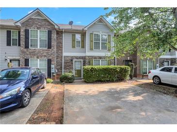 Charming townhome featuring a stone facade, neutral siding, and well-maintained landscaping at 3516 Waldrop Trl, Decatur, GA 30034