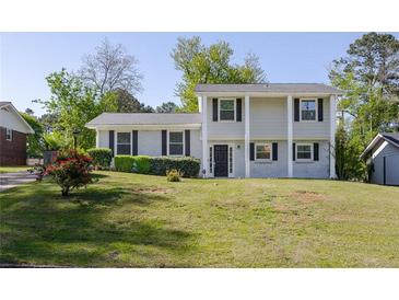 Charming two-story home featuring black shutters and a well-maintained front lawn at 2637 Elkhorn Dr, Decatur, GA 30034