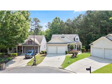 Charming home exterior featuring a well-manicured lawn and inviting curb appeal at 428 Redwood Trl, Canton, GA 30114