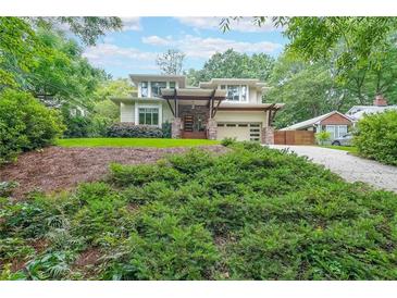 Stunning two-story home with lush greenery and a modern architectural design, blending nature with sophistication at 1267 Thomas Rd, Decatur, GA 30030