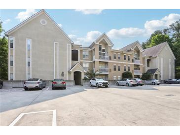 Beautiful condominium complex with manicured landscaping and ample parking spaces available for residents and guests at 3108 Westchester Ne Rdg, Atlanta, GA 30329