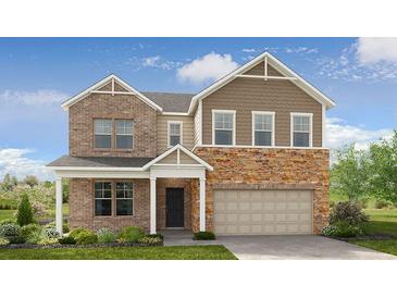 Charming two-story home with brick and stone accents, covered entry, and attached two-car garage at 92 Sheryl Way, Loganville, GA 30052