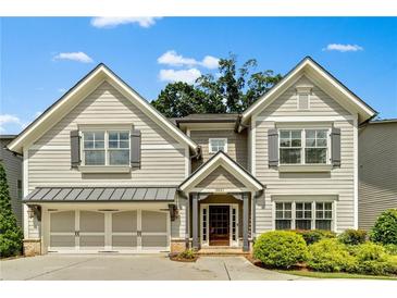 Charming two-story home with a welcoming entrance, complemented by lush landscaping and a two-car garage at 3821 Chamblee Dunwoody Rd, Atlanta, GA 30341