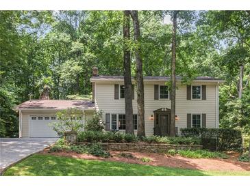 Charming two-story home with beautiful landscaping and a two-car garage at 5240 Arrie Way, Atlanta, GA 30360