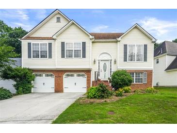 Charming two-story home featuring a well-maintained lawn and an attached two-car garage at 3485 Palisade Lake Dr, Duluth, GA 30096
