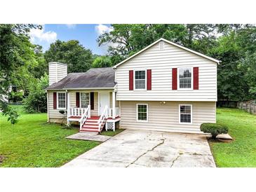 Charming split-level home with red shutters and a well-maintained front yard at 132 Bishop Nw Rd, Cartersville, GA 30121