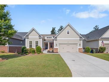 Charming single-Gathering home features a two-car garage, well-manicured lawn, and inviting front porch at 2245 Long Bow Chase, Kennesaw, GA 30144