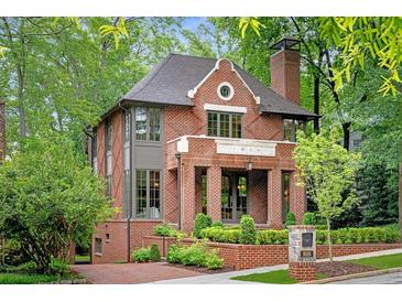 Charming brick home with manicured landscaping and a welcoming entrance at 1026 Reeder N Cir, Atlanta, GA 30306