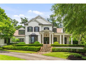 Stunning two-story home with manicured landscaping and a welcoming front porch at 980 Fenimore Cir, Atlanta, GA 30350