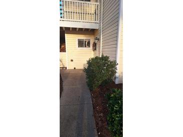 Charming home exterior with walkway and manicured landscaping at 1638 Raleigh Cir, Marietta, GA 30067