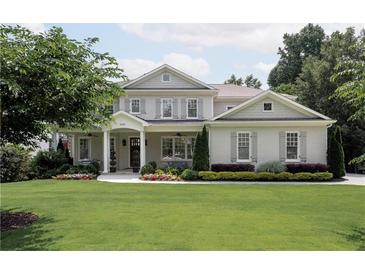 Charming two-story home with a well-manicured lawn and inviting front porch at 2909 Redding Road Northeast, Atlanta, GA 30319