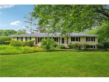 Charming ranch-style home with well-manicured front yard and lush landscaping at 2900 Townley Cir, Atlanta, GA 30340