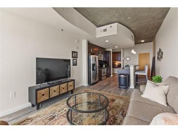 Modern living space featuring an open floor plan with stainless steel appliances at 361 17Th St # 2120, Atlanta, GA 30363