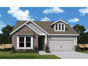 Charming single-Gathering home featuring a brick facade, well-maintained lawn, and a two-car garage at 1045 Pine Bark Ln, Canton, GA 30114