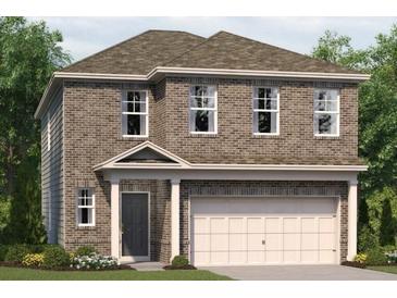 Two-story brick home with a two car garage and a covered front porch at 1240 Arnhem Dr, Hampton, GA 30228