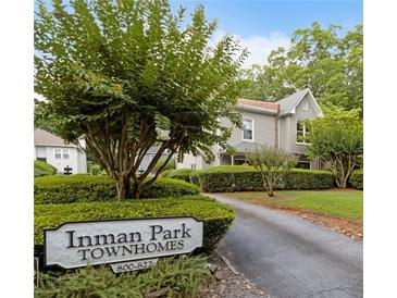 Charming townhome community with mature trees and manicured landscaping at 812 Dixie Ne Ave, Atlanta, GA 30307