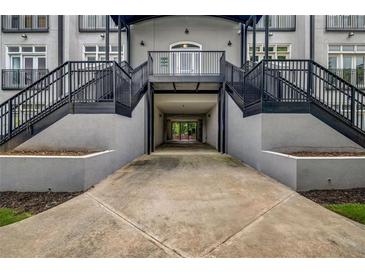 View of the entrance to the building with dual staircases and covered drive through area at 502 Sw Pryor Sw St # 325, Atlanta, GA 30312