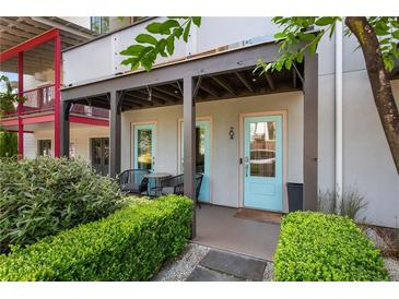Inviting front porch with a table and chairs, providing a charming outdoor seating area at 204 Wilbur Se Ave, Atlanta, GA 30316