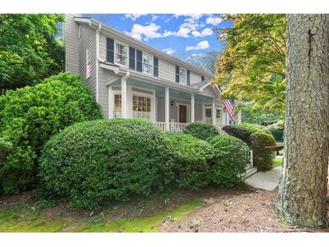 Charming two-story home with a covered front porch and lush green landscaping at 2789 Brookcliff Lndg, Marietta, GA 30062