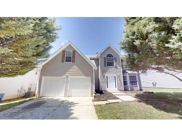 Charming two-story home with a two-car garage and well-maintained front yard at 625 Compton Ln, Mcdonough, GA 30253