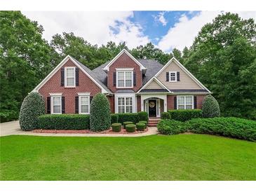 Charming brick home with manicured landscaping and a welcoming front entrance at 2995 Barimore, Dacula, GA 30019