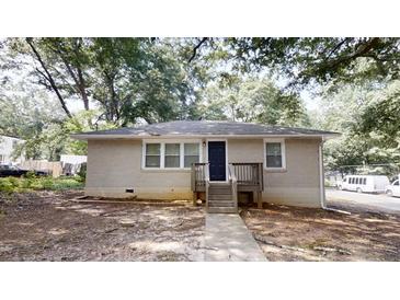Charming one-story home with a brick facade, black front door and a cozy front porch at 568 Mcwilliams Se Rd, Atlanta, GA 30315