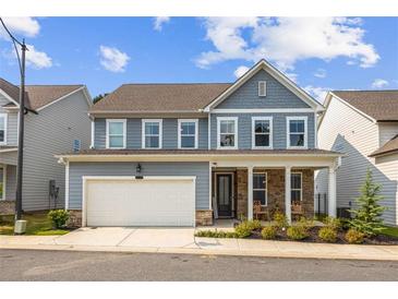 Charming two-story home with a covered front porch and two car garage at 639 Tigers Eye Ter, Kennesaw, GA 30144