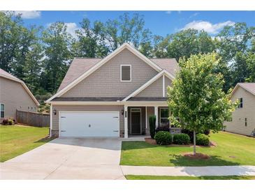 Charming craftsman-style home with a well-maintained lawn and a two-car garage at 151 Rolling Hills Pl, Canton, GA 30114